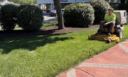 Landscaping professional mowing commercial property.